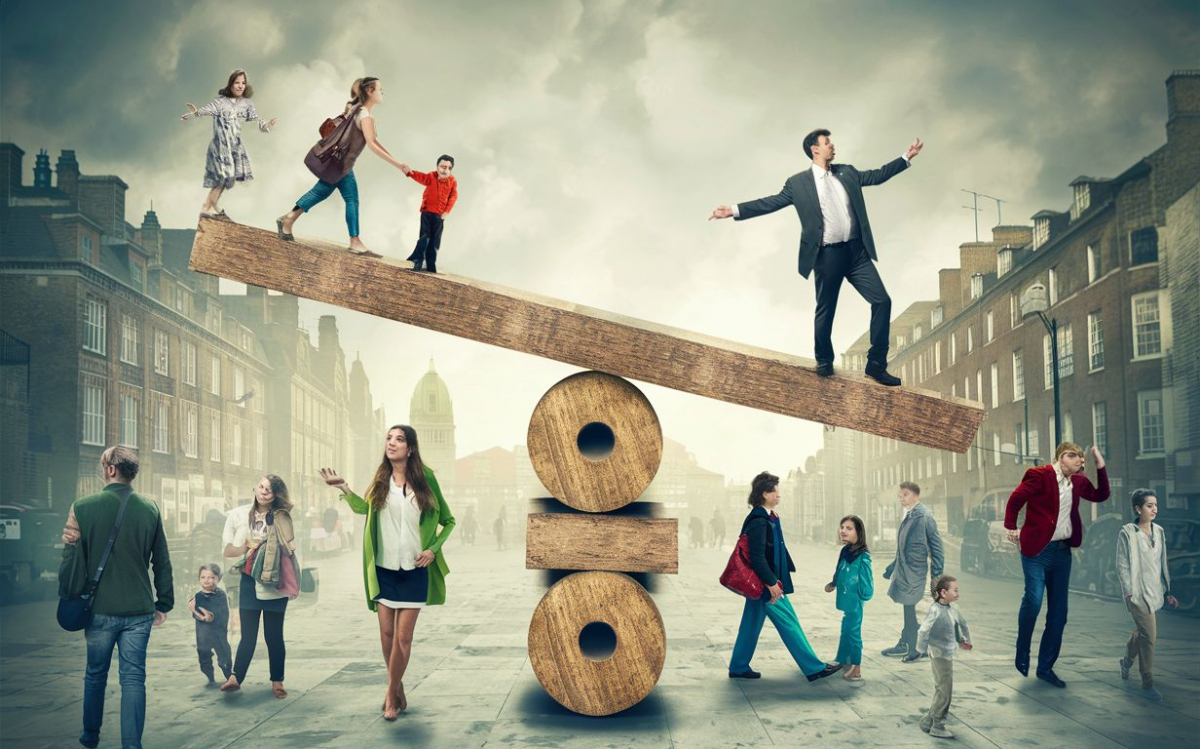 a busy london street with a wooden balancing seesaw